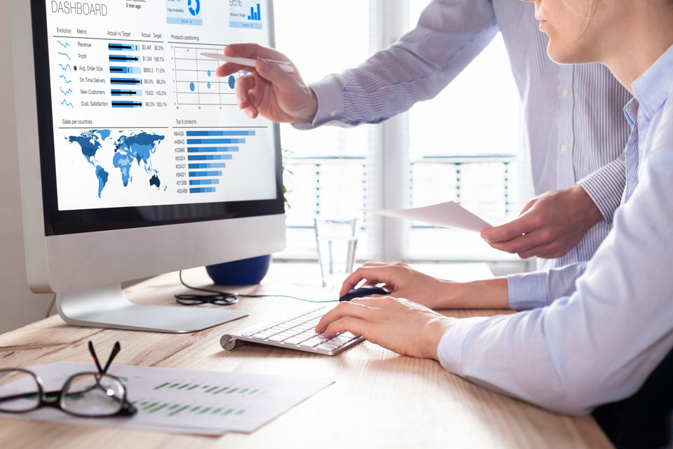AdobeStock_172670704 two people looking at website anaylitics