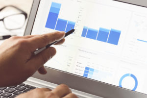 person pointing at web analytics